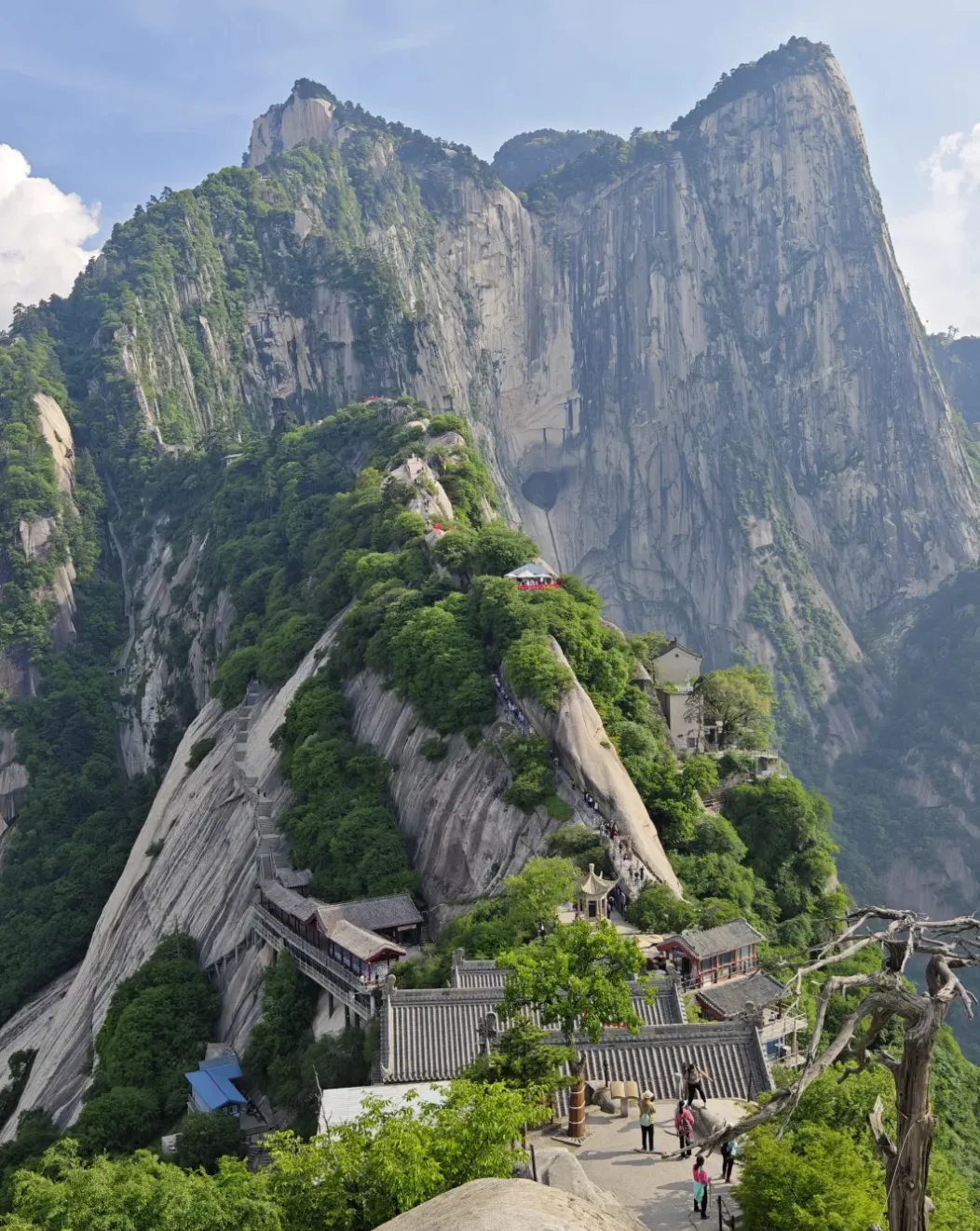 The narrow ridge trail of Mount Huashan dropping between granite peaks